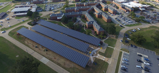 Daytime aerial view of solar carports at VISN-7